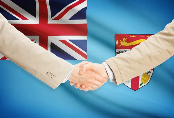 Businessmen handshake with flag on background - Fiji — Stock Photo, Image