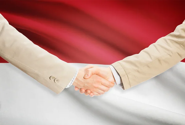 背景 - インドネシアの旗とビジネスマン握手 — ストック写真