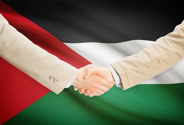 Επιχειρηματίες χειραψία με σημαία σε φόντο - Jordan — Φωτογραφία Αρχείου