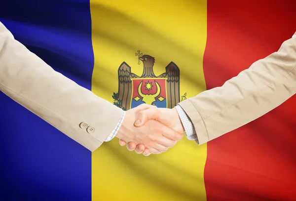 Businessmen handshake with flag on background - Moldova — Stock Photo, Image