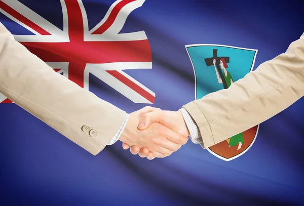 Businessmen handshake with flag on background - Montserrat — Stock Photo, Image