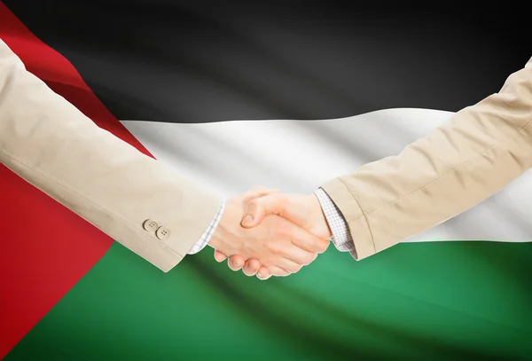 Poignée d'hommes d'affaires avec le drapeau sur fond - Palestine — Photo