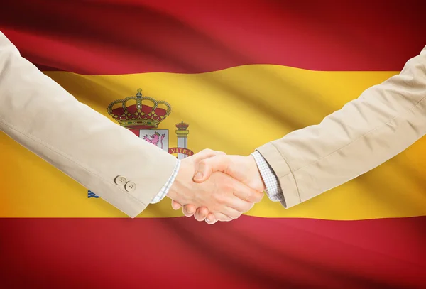 Businessmen handshake with flag on background - Spain — Stock Photo, Image