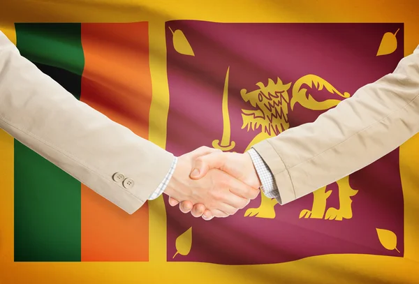Unternehmer-Handshakes mit Flagge auf Hintergrund - Sri Lanka — Stockfoto