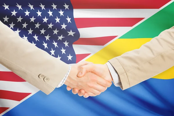 Podnikatelé handshake - USA a Gabon — Stock fotografie