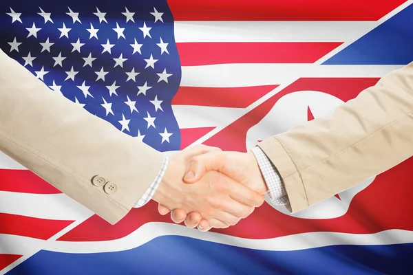 Businessmen handshake - United States and North Korea — Stock Photo, Image