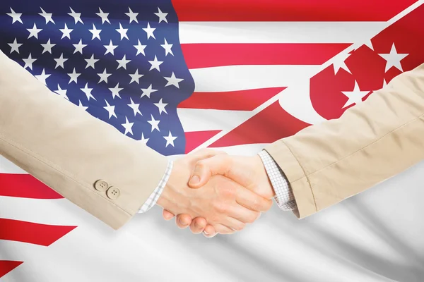 Businessmen handshake - United States and Singapore — Stock Photo, Image