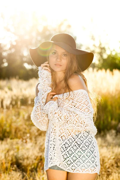 Beautiful young lady model in field - sunrise shot — Stock Photo, Image