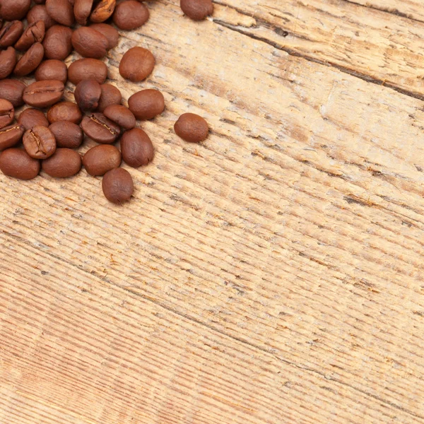 Coffee beans spread over table - close up shot — Stock Photo, Image