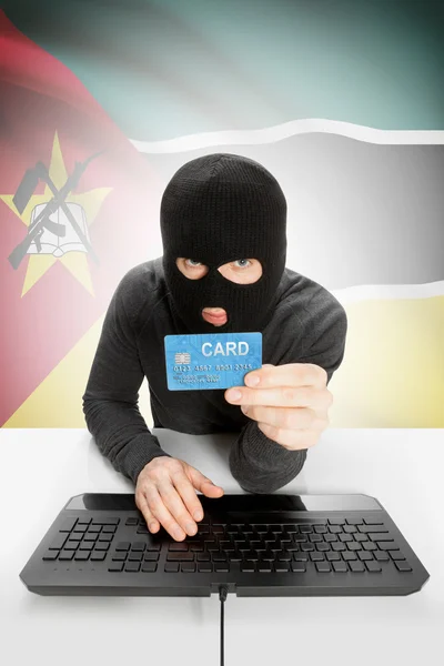 Cybercrime concept with national flag on background - Mozambique —  Fotos de Stock