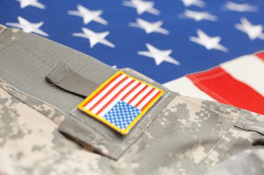 USA flag with army uniform - close up studio shot