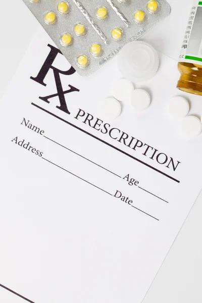 Medical drug prescription and pills over it - studio shot — Stock Photo, Image