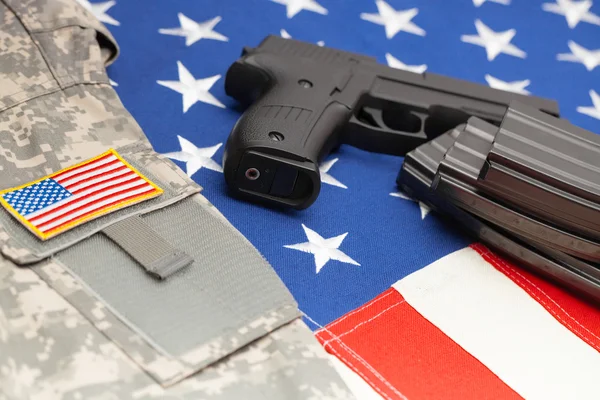 Handgun over US flag - close up studio shoot Fotos de stock