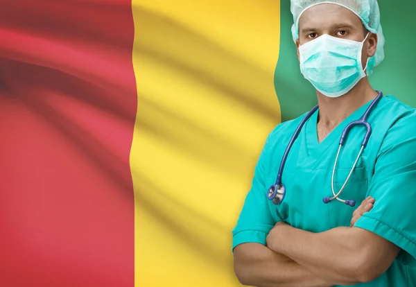 Surgeon with flag on background series - Guinea — Stock Photo, Image