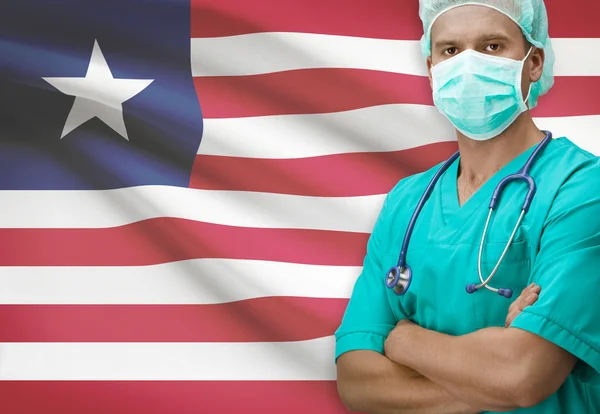 背景シリーズ - リベリアの旗と外科医 — ストック写真
