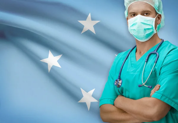 Хирург с флагом на фоне серии - Микронезия — стоковое фото
