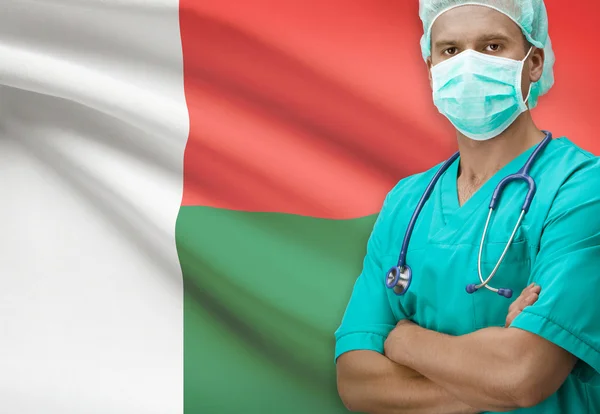 Surgeon with flag on background series - Madagascar — Stock Photo, Image