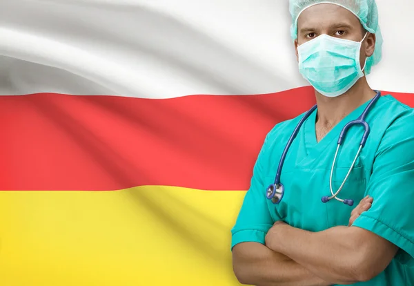 Cirujano con bandera en serie de fondo - Osetia del sur —  Fotos de Stock