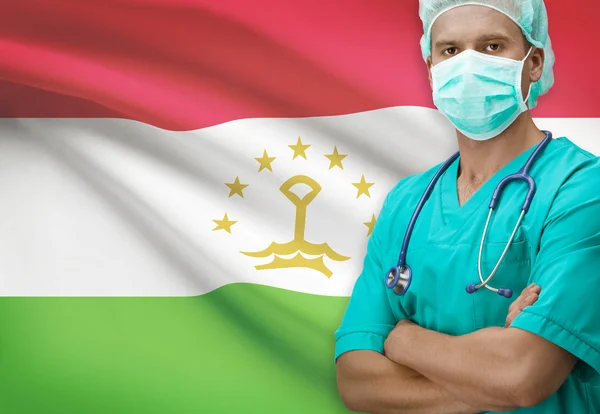 Хирург с флагом на фоне серии - Таджикистан — стоковое фото