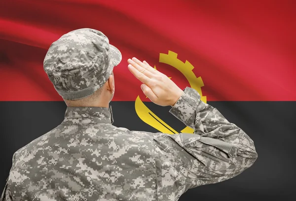 Soldier in hat facing national flag series - Angola — Stock Photo, Image