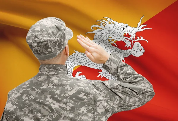 Soldier in hat facing national flag series - Bhutan — Stock Photo, Image