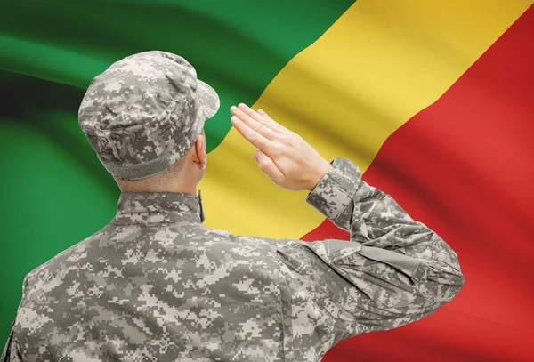Soldier in hat facing national flag series - Congo-Brazzaville — Stock Photo, Image