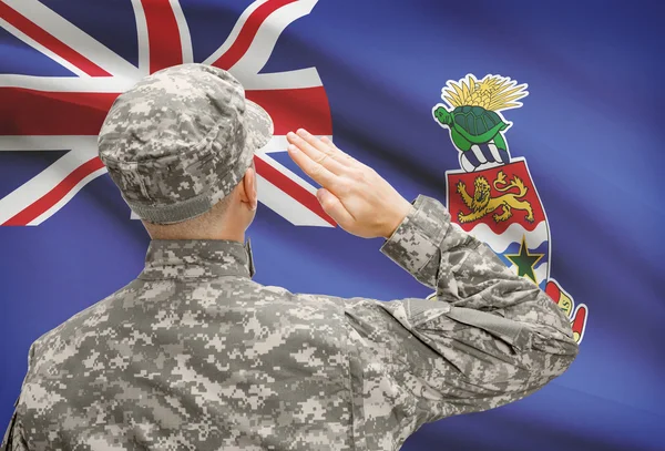 Soldier in hat facing national flag series - Cayman Islands — Stock Photo, Image