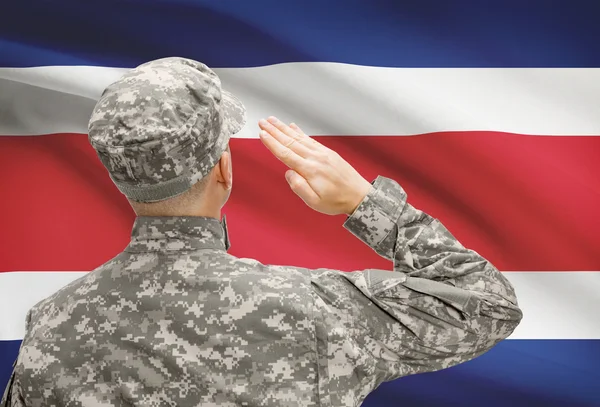 Soldier in hat facing national flag series - Costa Rica — Stock Photo, Image