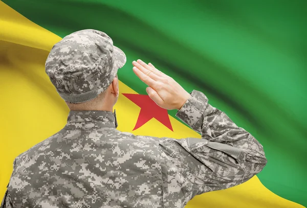 Soldier in hat facing national flag series - French Guiana — Stock Photo, Image