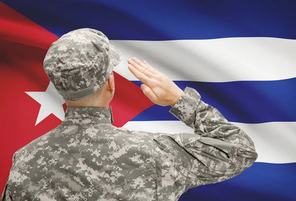 Soldier in hat facing national flag series - Cuba – stockfoto