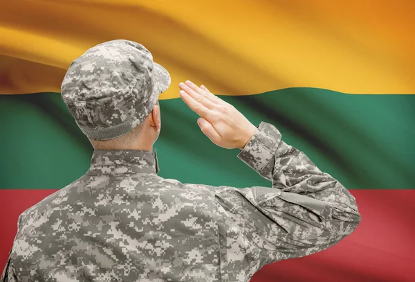 Soldier in hat facing national flag series - Lithuania — Stock Photo, Image