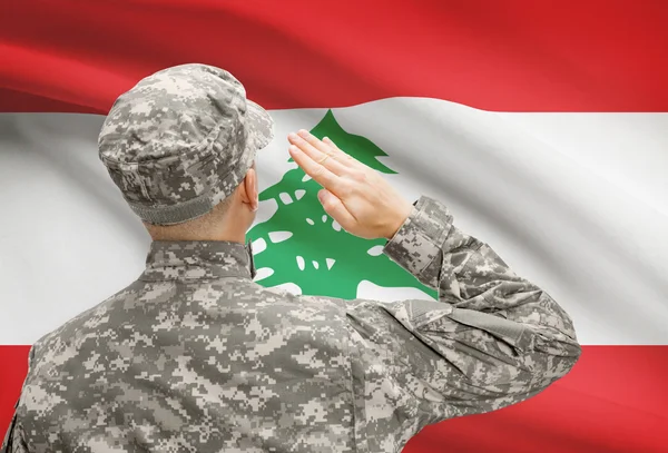 Soldier in hat facing national flag series - Lebanon — Stock Photo, Image