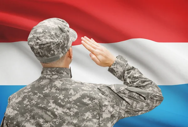 Soldier in hat facing national flag series - Luxembourg — Stock Photo, Image