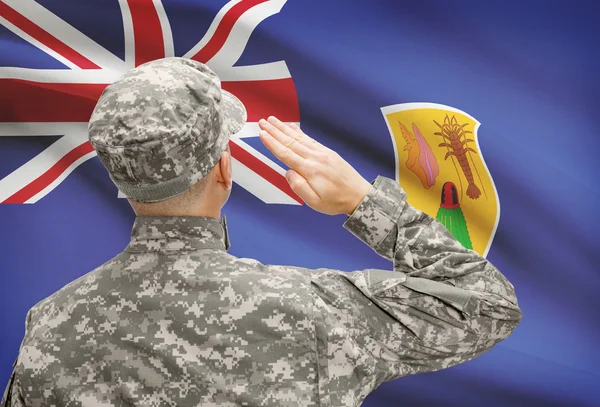 Soldier in hat facing national flag series - Turks and Caicos Islands — Stock Photo, Image