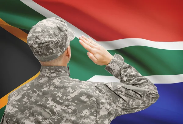 Soldier in hat facing national flag series - South Africa — Stock Photo, Image