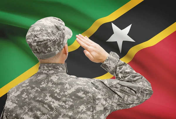 Soldier in hat facing national flag series - Saint Kitts and Nevis — Stock Photo, Image