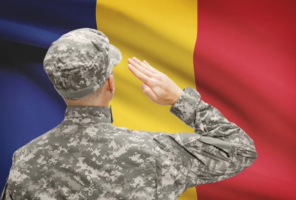 Soldier in hat facing national flag series - Romania — Stock Photo, Image