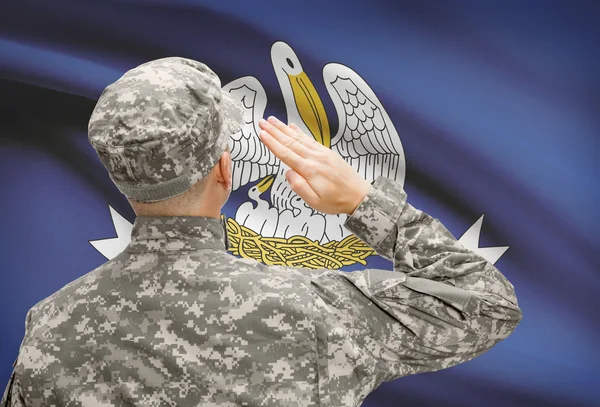Soldier saluting to US state flag series - Louisiana — Stock Photo, Image