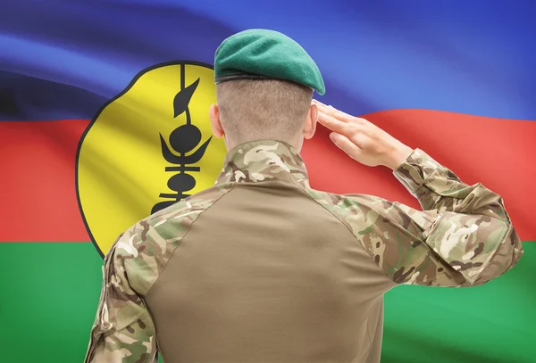 Národní vojenské síly s vlajkou na pozadí koncepční řady - Nová Kaledonie — Stock fotografie