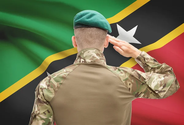 Fuerzas militares con la bandera en la serie conceptual de fondo - Saint Kitts y Nevis — Foto de Stock