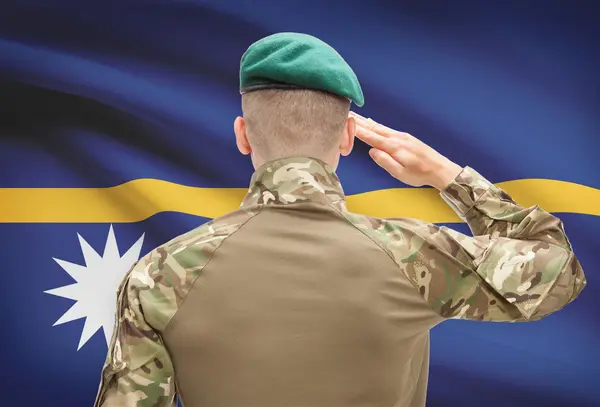 Národní vojenské síly s vlajkou na pozadí koncepční řady - Nauru — Stock fotografie