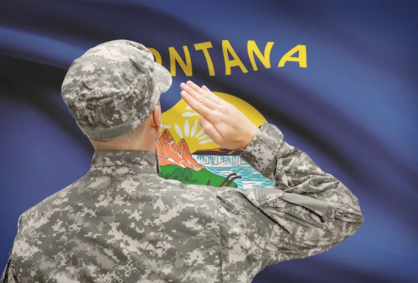 Soldier saluting to US state flag series - Montana — Stock Photo, Image
