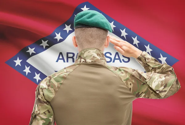 Soldier saluting to USA state flag conceptual series - Arkansas — Stock Photo, Image