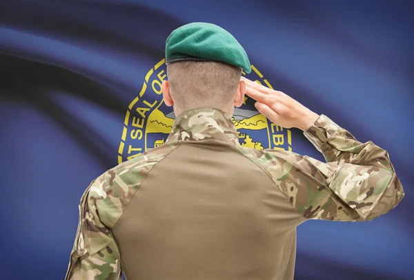 Soldier saluting to USA state flag conceptual series - Nebraska — Stock Photo, Image