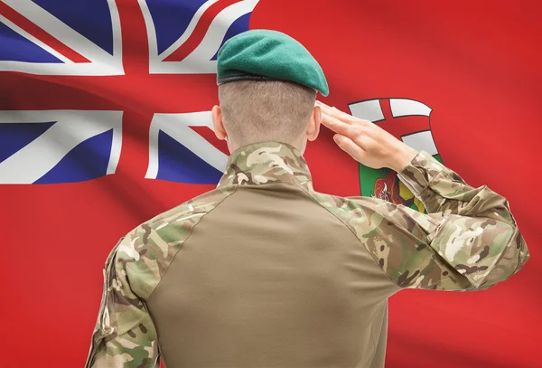 Soldier saluting to Canadial province flag conceptual series - Manitoba — Stock Photo, Image