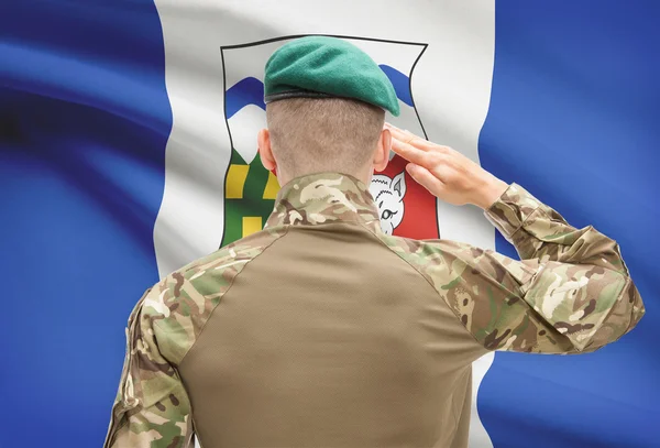 Soldier saluting to Canadial province flag conceptual series - Northwest Territories — Stock Photo, Image