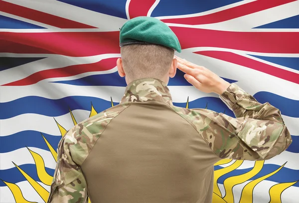 Soldier saluting to Canadial province flag conceptual series - British Columbia — Stock Photo, Image