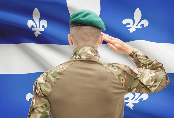 Soldado saludando a la provincia de Canadial bandera conceptual serie - Quebec — Foto de Stock