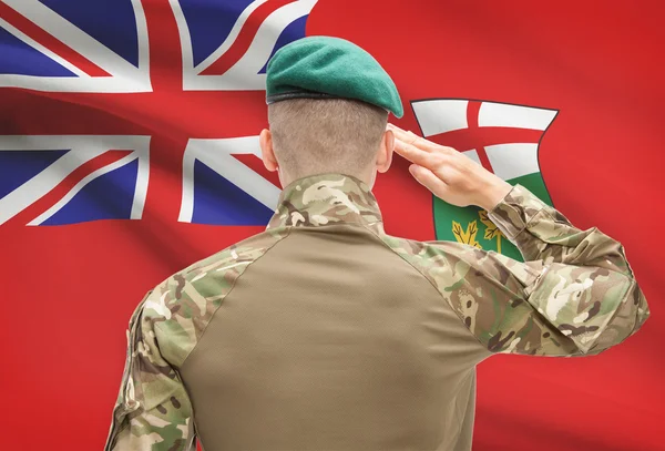 Soldier saluting to Canadial province flag conceptual series - Ontario — Stock Photo, Image