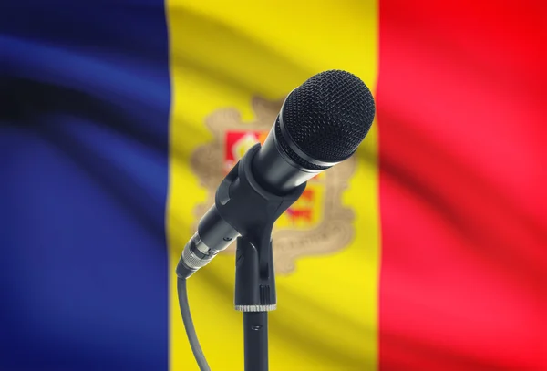 Microphone on stand with national flag on background - Andorra — Stock Photo, Image